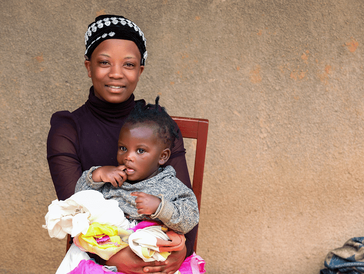 Adeline and a child in Rwanda