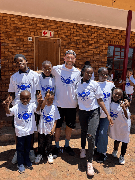 Children and volunteers at a community event