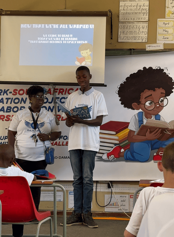 Children presenting their work at a charity event