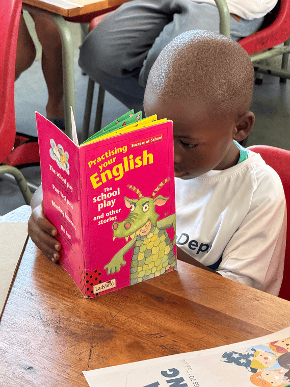 A child enjoying a reading activity