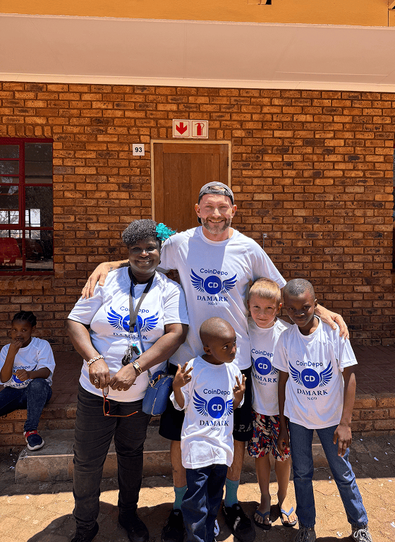 Volunteers and children gathered outside